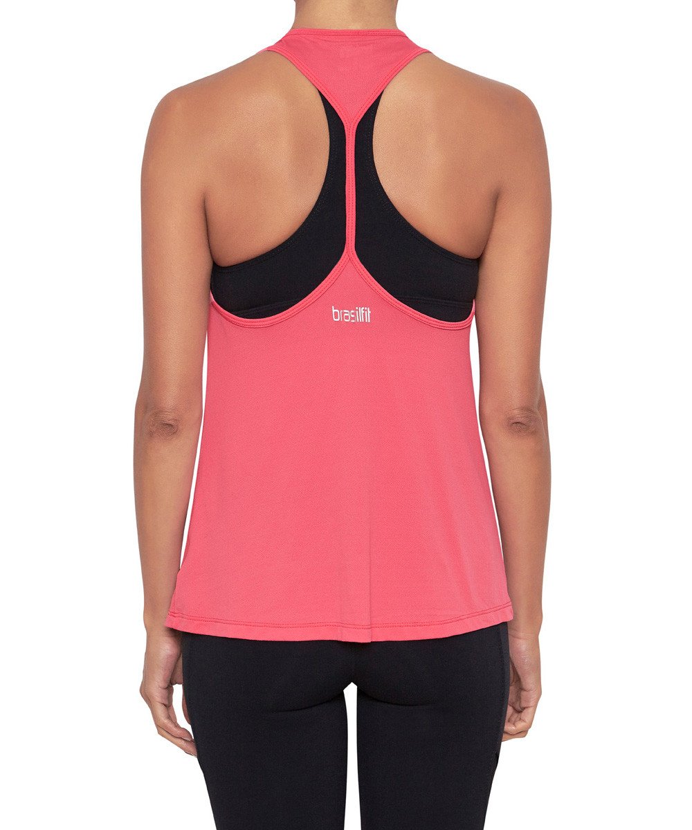 Front view product image with model for Brasilfit activewear W workout tank in Raspberry.  The W workout tank is part of our activewear collection that is focused on performance, high compression activewear.