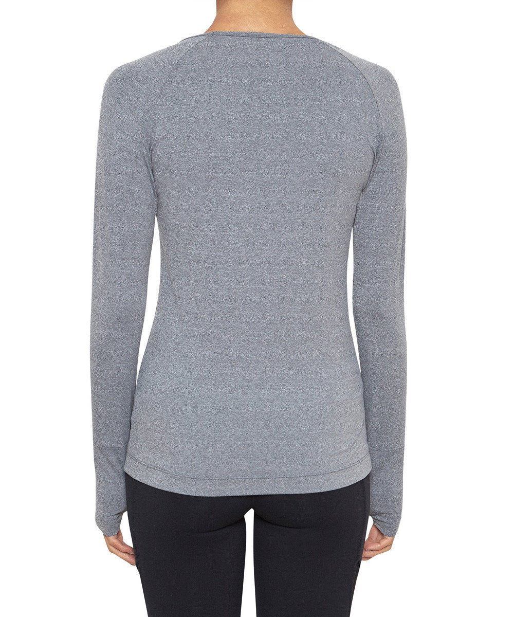 Front view product image with model for Brasilfit activewear Q long sleeve t-shirt in gray.  The Q long sleeve T-shirt is part of our basics activewear collection that is focused on performance, high compression activewear.